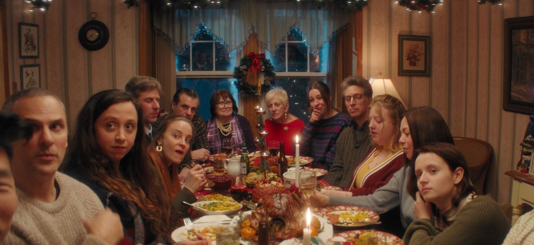 A scene from Christmas Eve in Miller's Point featuring a family gathered around a festive dinner table on Christmas Eve.