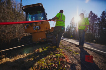 Construction workers installing cable broadband.