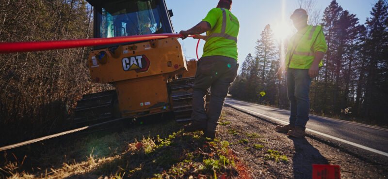 Construction workers installing cable broadband.